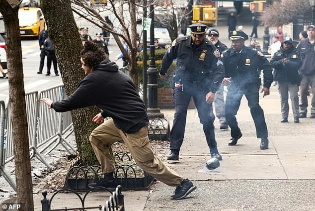 NYPD Officer's Viral Leap Becomes Symbol Of Law Enforcement Resolve As Pursuit Unfolds Amid Explosive Protests