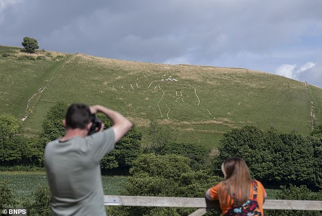 National Trust begins historic restoration of giant chalk figure.