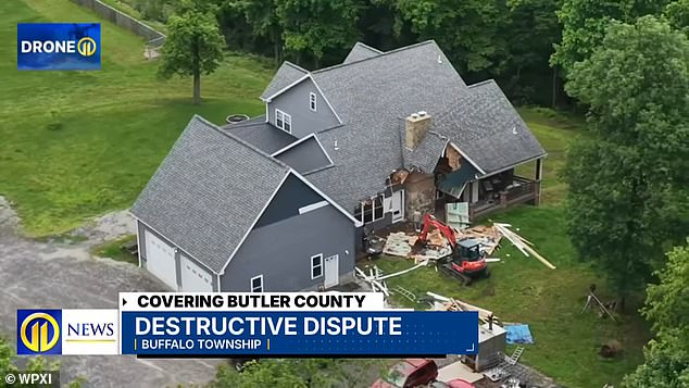 Man Arrested After Allegedly Demolishing Own Home With Excavator While Family Inside